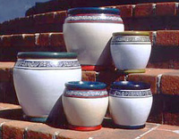 A selection of outdoor pots with a hand painted design