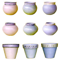 A selection of glazed ceramic pots with a hand painted design