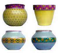 A selection of hand painted designs on different indoor and outdoor glazed pot shapes